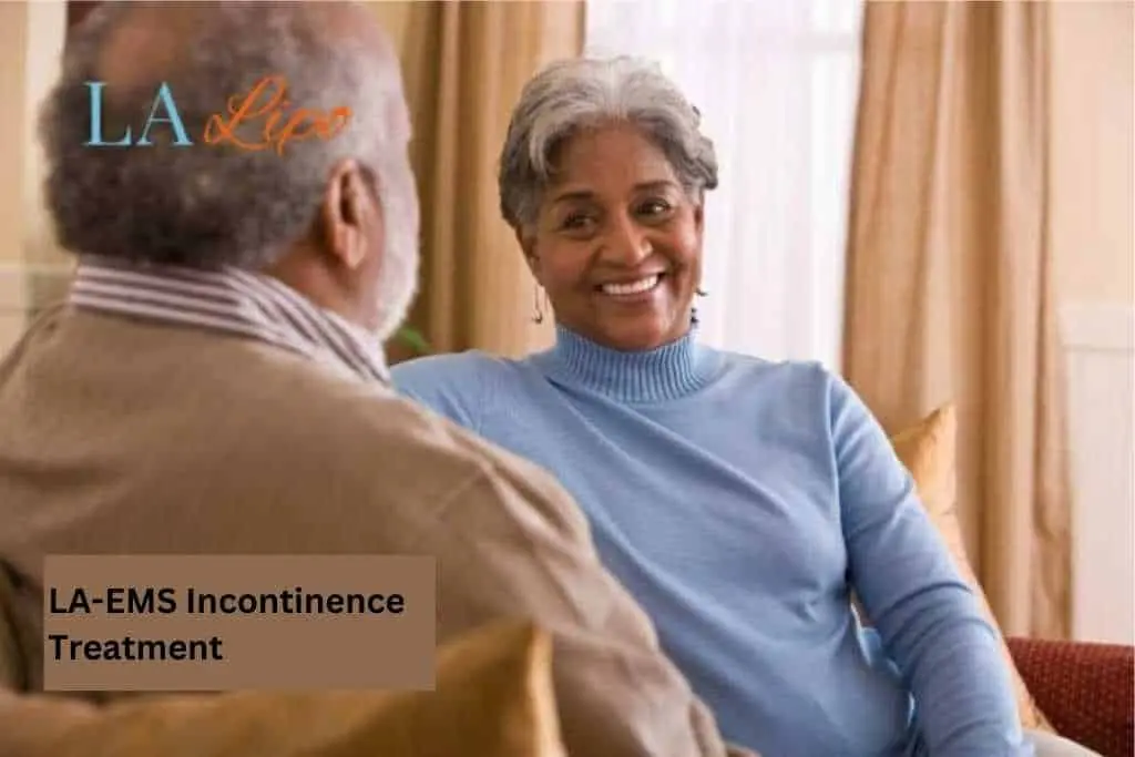 Couple sat smiling at each other - LA-EMS treatment Sandbach